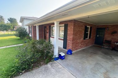 A home with a front porch and a garage.