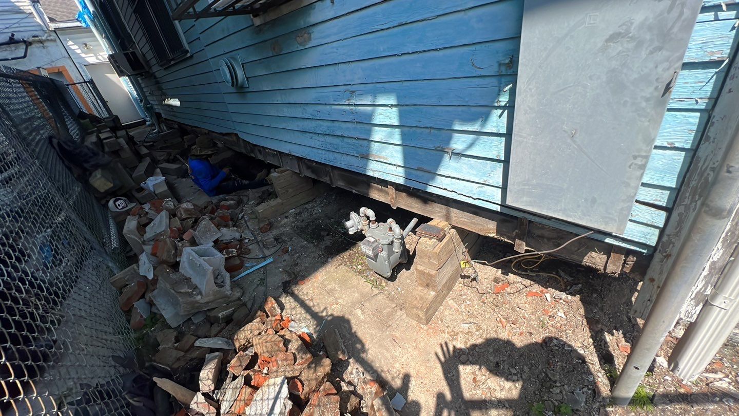 A flood-damaged house in need of foundation repair.