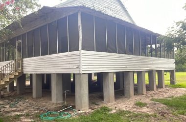A house with steps in the yard.
