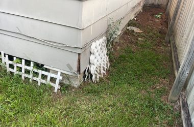 A house with a white fence.