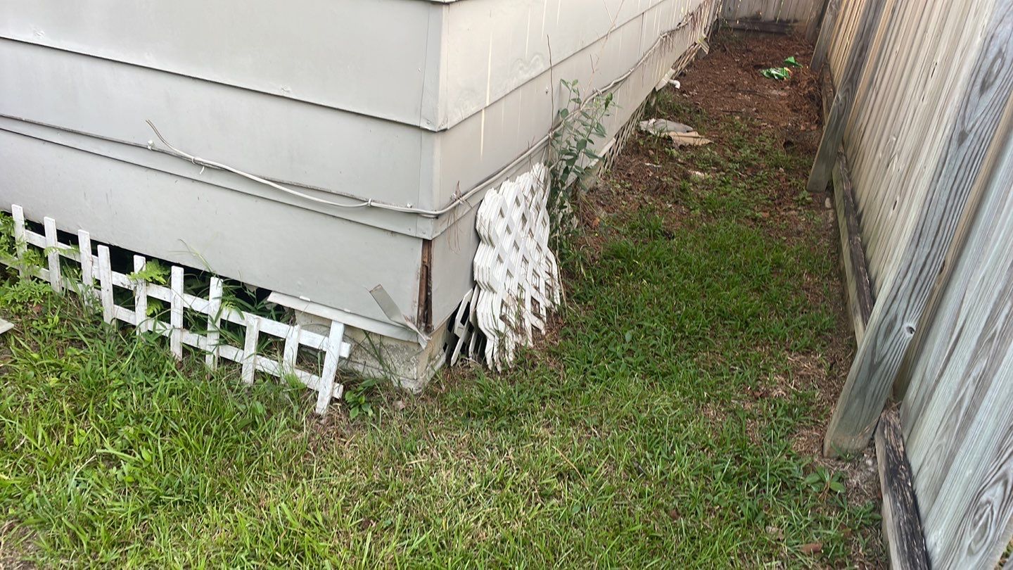 A house with a white fence.