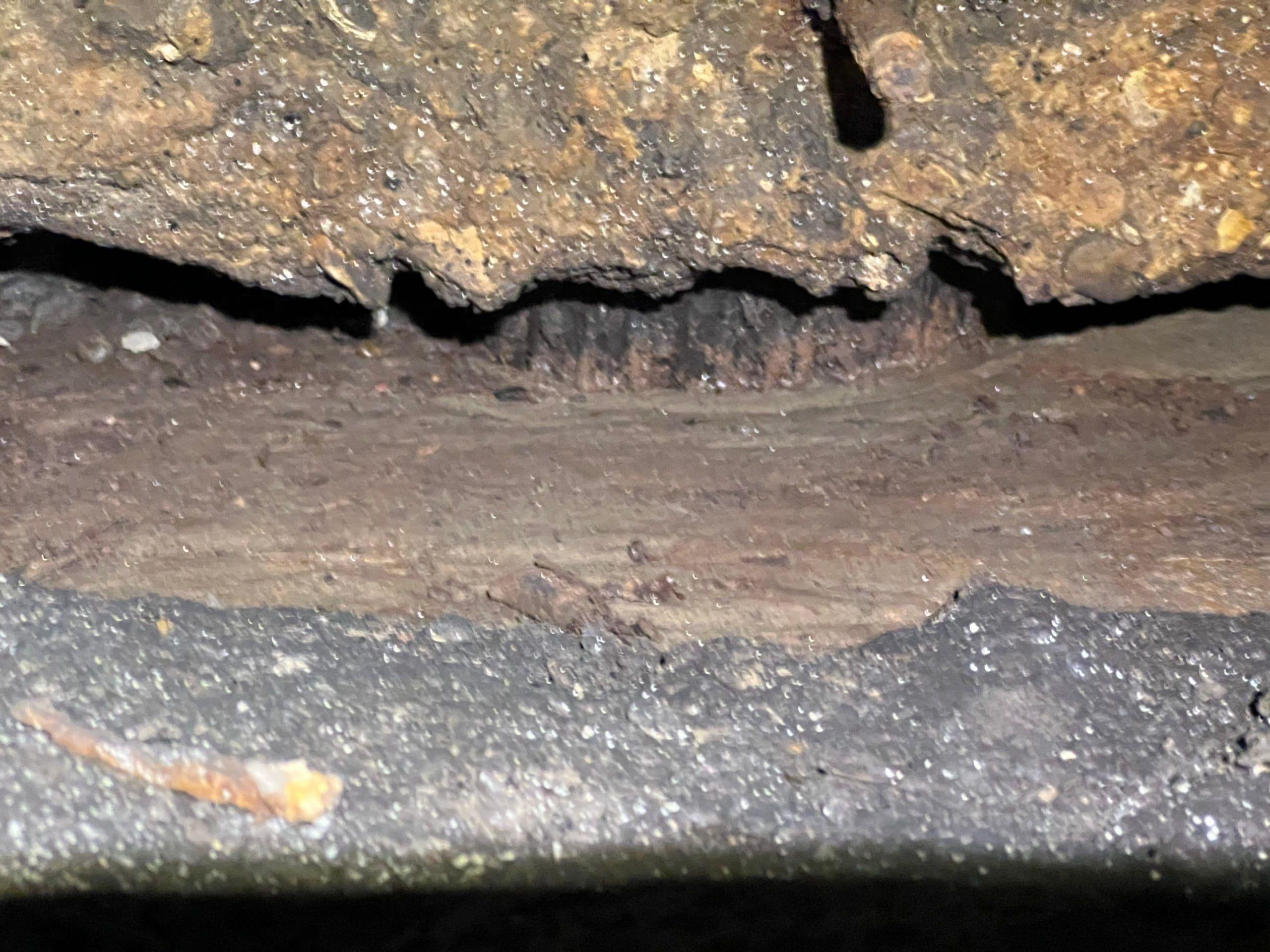 A hole in the ground in need of foundation repair.