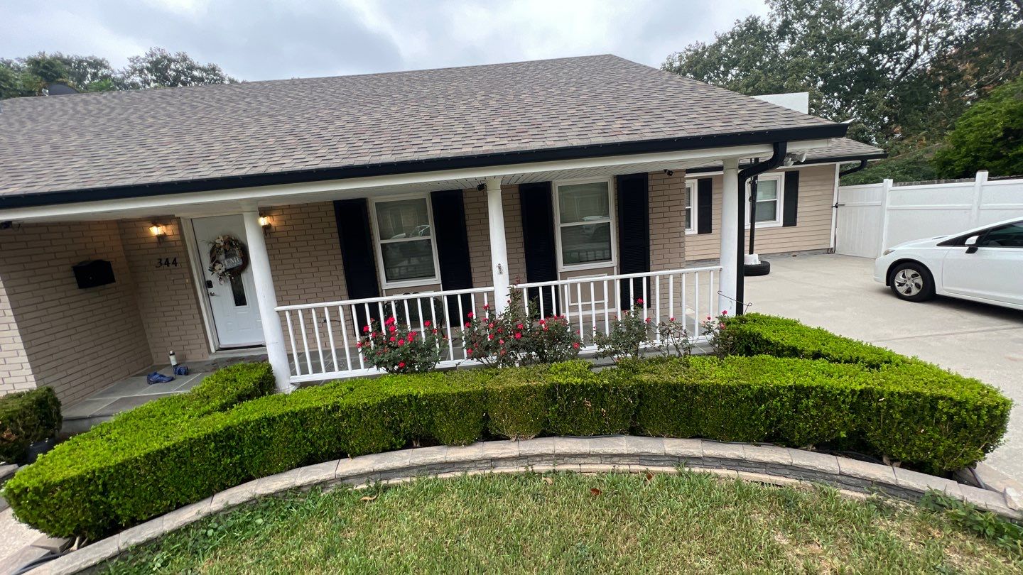A house with a car parked in front of it.