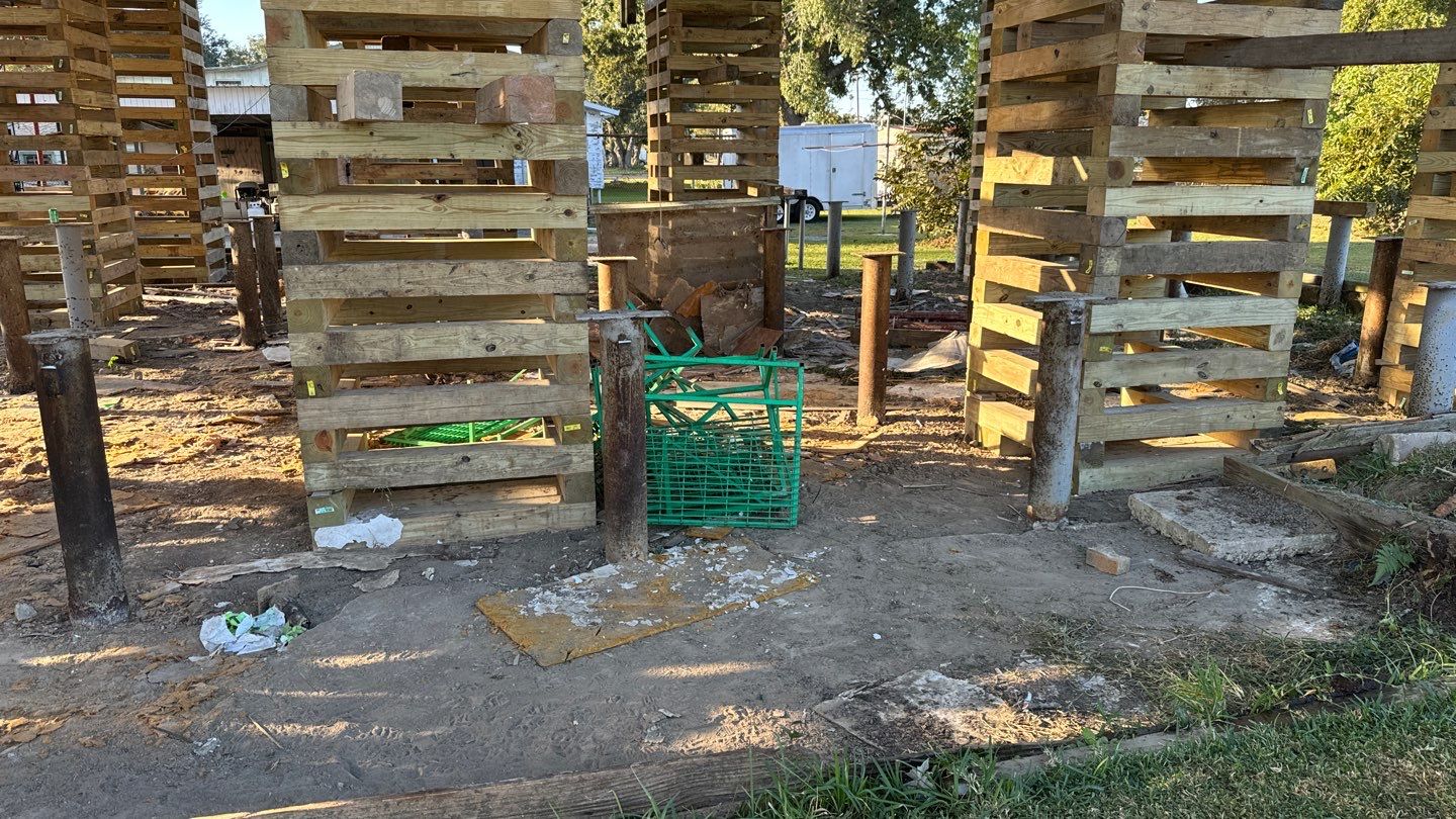 A pier and beam structure is being built in a yard, addressing any existing problems with the foundation.
