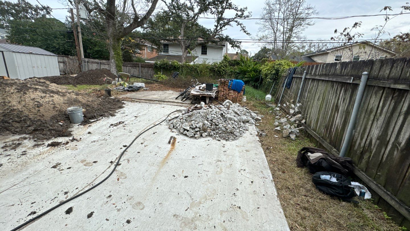 A backyard is being worked on by a construction crew.