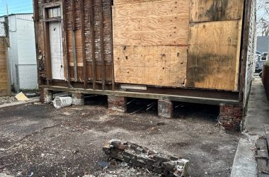 A boarded-up house sitting in a backyard in Louisiana.