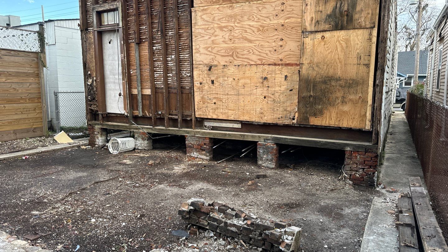 A boarded-up house sitting in a backyard in Louisiana.